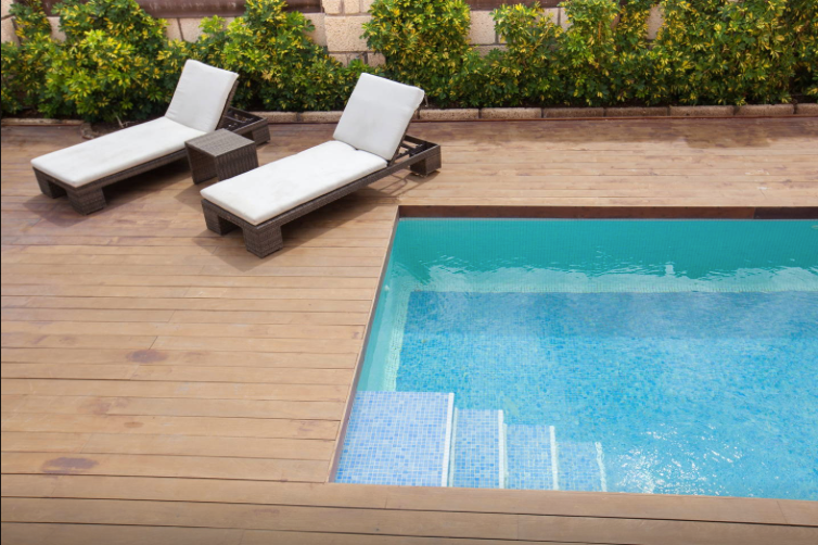 Private pool with sun loungers on a wooden deck at the townhouse in La Caleta